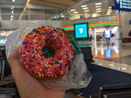 Doughnut with pink frosting and rainbow sprinkles. After looking at my receipt, I just realized they didn't charge me for this.