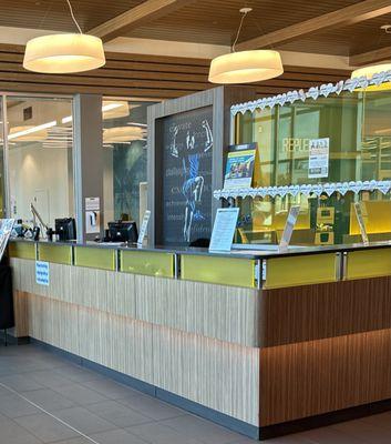 This is the front desk where one kid is face down on the desk (napping?) and the other can't see over the counter (hiding?)