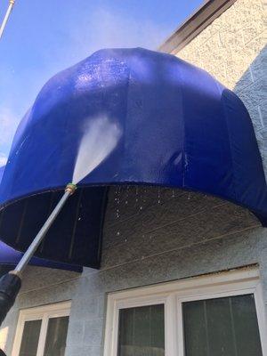 Power washing awnings.