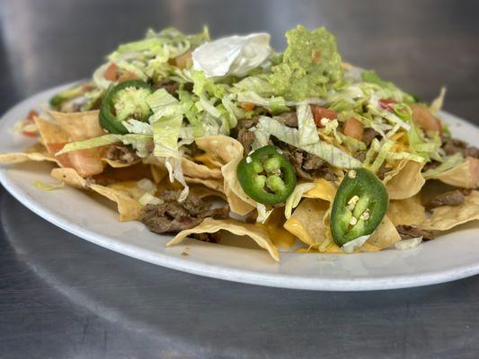 House nachos with steak