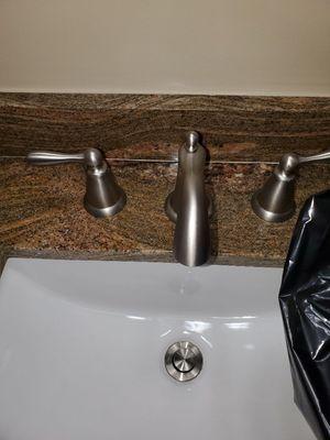 Install faucets and drains.