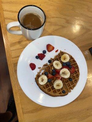 Waffles with fruits on top , coffee is so good!