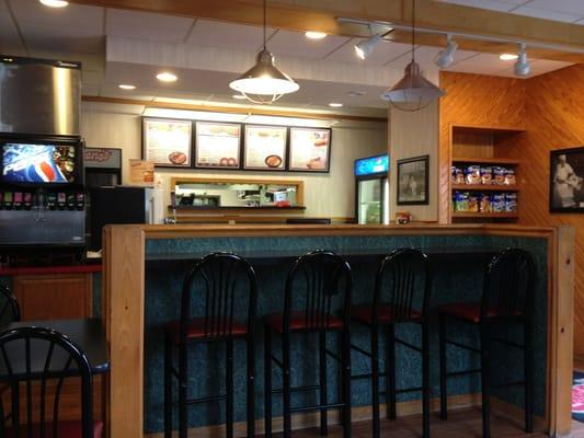 Stools, drink machine, front counter, and chips from dining room