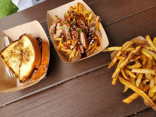 Brisket sandwich with fries and baked beans as the sides. Loaded fries with pulled pork.