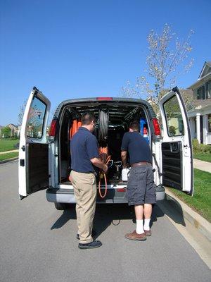 Unloading the carpet cleaning equipment.