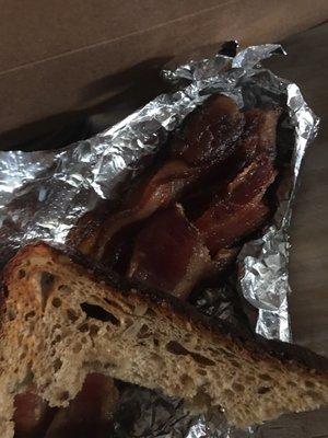 my freshly burnt and not crispy chewy glooey bacon and toast....