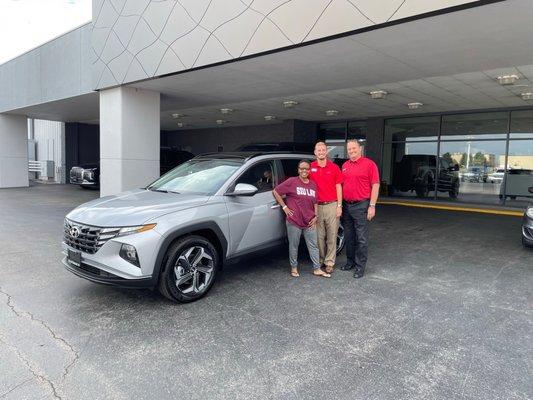 Me, T. J., and Travis in front of my new car! September 2, 2022