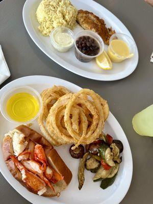 Scamp grouper with black beans and rice and a Hot lobster roll with onion rings and veggies.