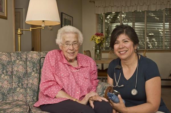 Nurse practitioner Maria Bucio enjoying time spent with Sr. Barbara Collier.