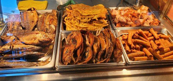 Left to right - tilapia, tortang talong (eggplant omelette), bangus (milkfish), lechon kuwali (pork belly), lumpia Shanghai