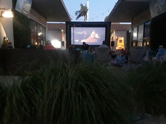 Enjoying a. Outdoor movie: the Incredibles 2