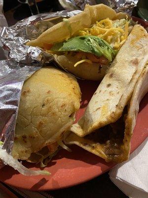 Beef gordita, carne guisada with cheese, and a puffy chicken taco