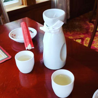 Large hot sake, bow tie serves as drip guard!