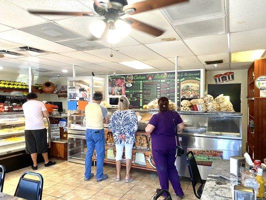 People ordering and picking up delicious food