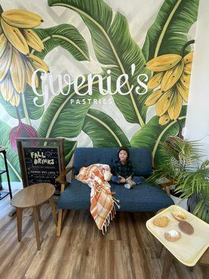 Love seat area next to the utensils and bathroom, cozy spot for our spontaneous mama-baby hangout