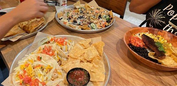 Shrimp nachos, shrimp tacos, blackened salmon bowl