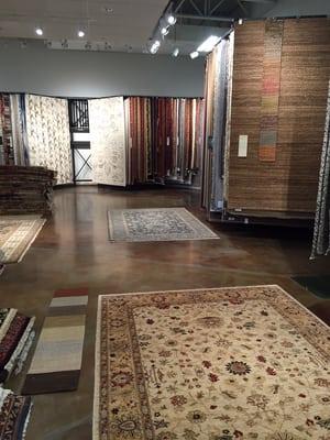 At Azia, our rugs are displayed on racks for easy viewing.