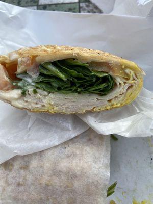 Turkey wrap with spinach and tomato, mustard and mayo