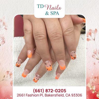 Radiate warmth and energy with vibrant orange nails, adding a pop of color to your look with a touch of playful charm.