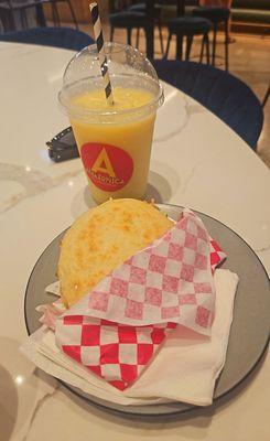 The Reina Pepiada Arepa,  with shredded chicken and avocado plus a Sunshine Smoothie with pineapple   and mango!