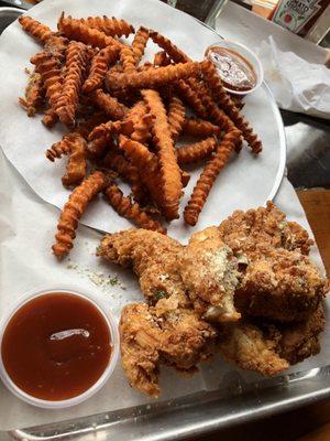 Sweet potato fries and chicken tenders with mango bbq sauce