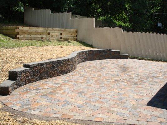 Installation of a paver patio and retaining wall.