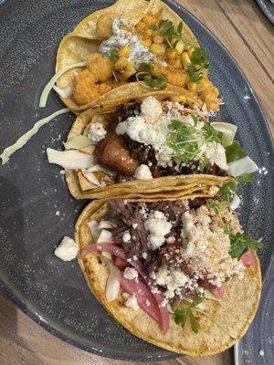 Popcorn lobster, pork belly and barbacoa tacos