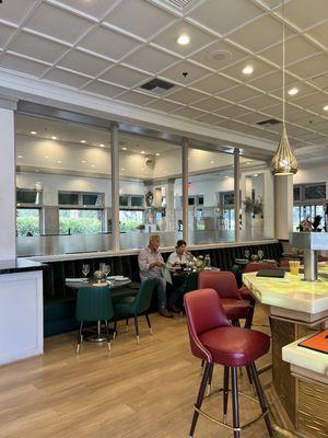 Small bar table seating directly behind the bar