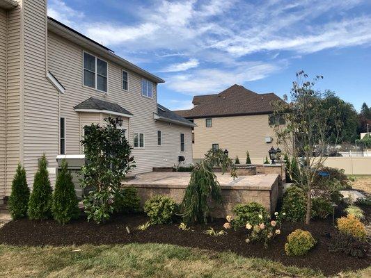 Patio elevation with Sherwood collection Sahara Chestnut lite together with landscape design and fire pit