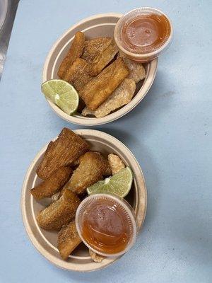 Fried Yucca with a side of salsa and limes.