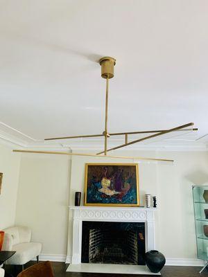 Installation of a light fixture by one of our licensed electricians in a Chicago home.