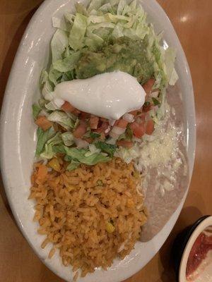 Mexican rice, lettuce, tomatoes, guacamole, and sour cream for Fajita.