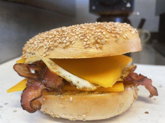 The Basic Bird (cheddar, fried egg, bacon or sausage on a sesame bagel). Wrapped and ready