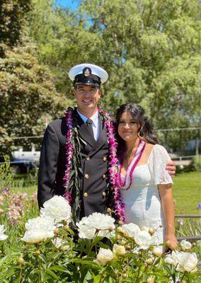 The Groom is wearing a Maile Style Ti Leaf with Orchid Lei Wrap & The Bride is wearing a Purple Christina Lei