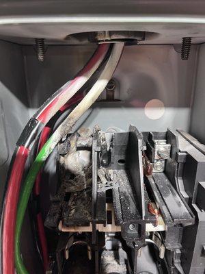 Melted wires in the AC disconnect box.