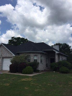 An Owens Corning onyx black roof that was put on in June 2016 in Forney - we like the color with this brick