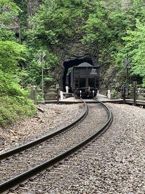 Train entering smaller tunnel