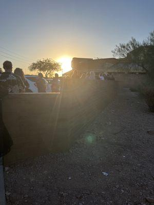 A whole group of us waiting outside 2+ hours with no water in 105 degree heat for them to NOT open the doors or start the show on time!