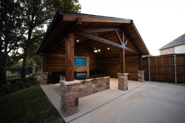 Beautiful new outdoor space renovation complete with an outdoor kitchen, pool deck and handcrafted pergola perfect for hosting!