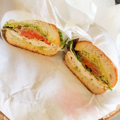 Chicken pesto sandwich on sourdough roll with jalapeño spread - sooo good