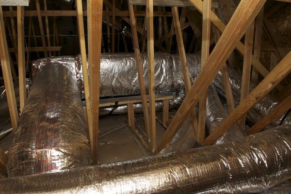 Energy efficient heat pump installation. All ducts get buried beneath insulation for effective R values over R-20!