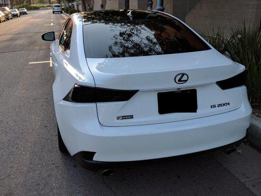 Roof wrap, back window tint, black emblems, and special light cover clear coat tint modifications added