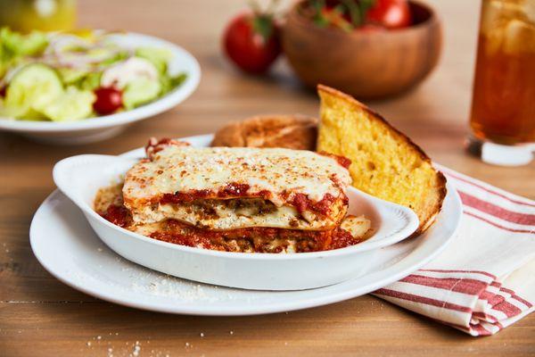 LASAGNA - Always a classic! Layers of seasoned ricotta, mozzarella, sliced meatballs & crumbled sausage baked in our marinara...