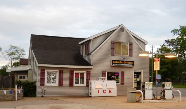 Main building of AuTrain Grocery, Motel & Gas. Prepared food including pasties, ice cream, beer, snacks & fishing permits available within.