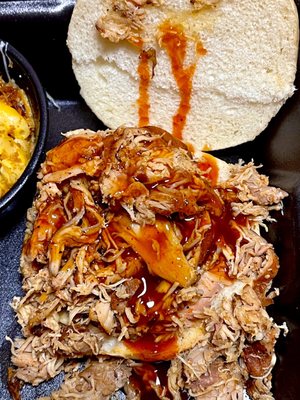 Pulled chicken sandwich slathered with Tupelo honey hot bbq sauce