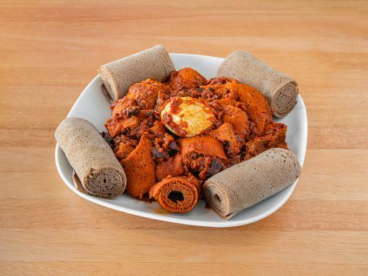 Quanta Fir Fir 
(jerky meat + tomatoes + onions + hard cooked eggs with ethiopian butter and spices