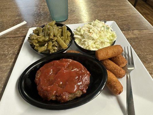 The amazing Meatloaf with green beans, slaw, and hush puppies.  Yummmm!