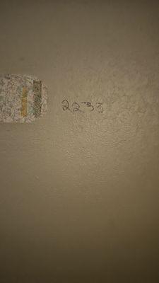 Room number written on the wall