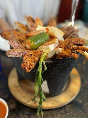 Artistic photo of the Molcajete trying to match the delight of this presentation.