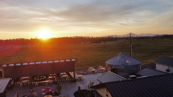 Wetlands tap house with background scenery of sunset with mountains